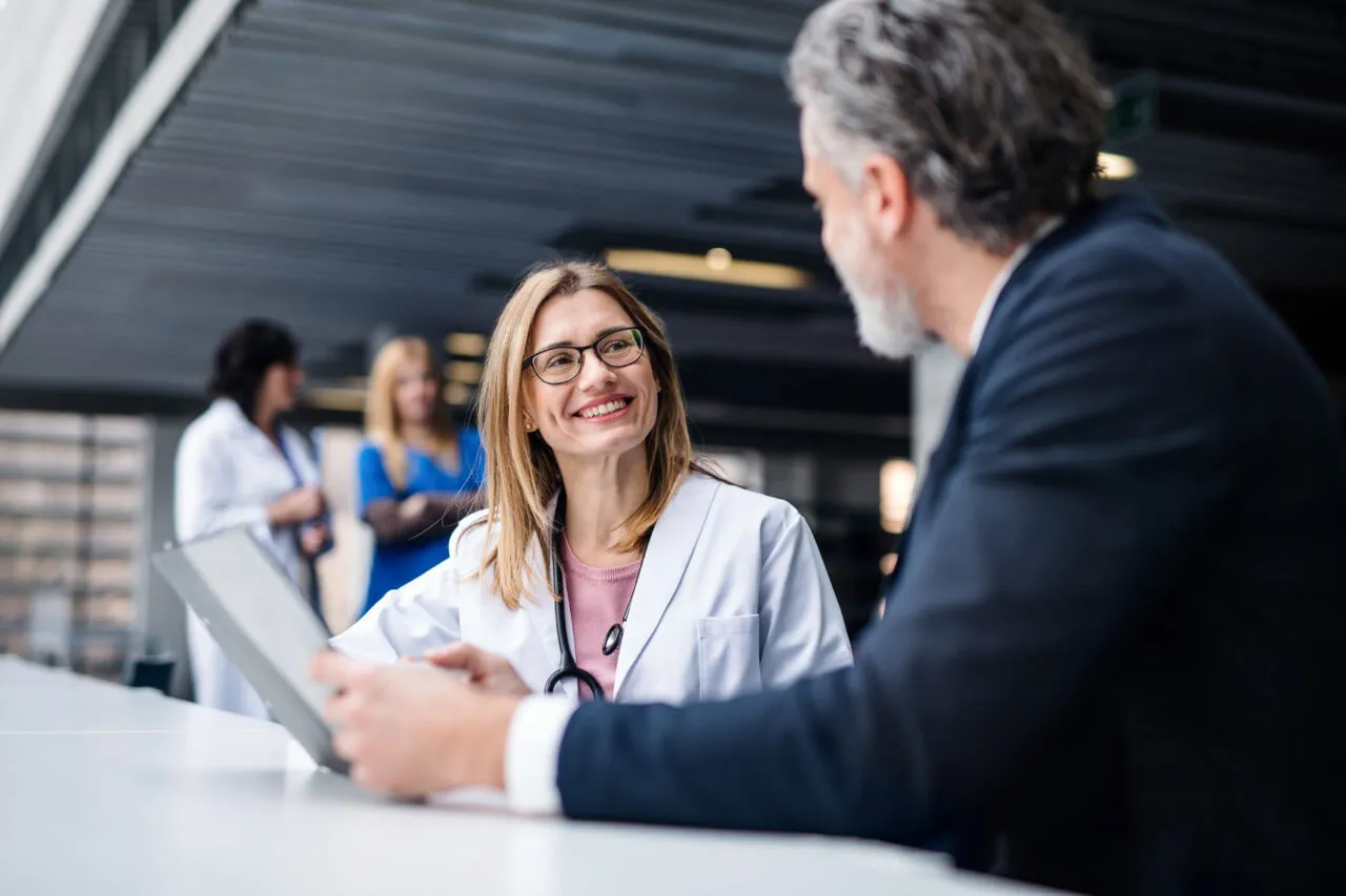 Doctor talking to a pharmaceutical sales representative. Doctor talking to a pharmaceutical sales representative.